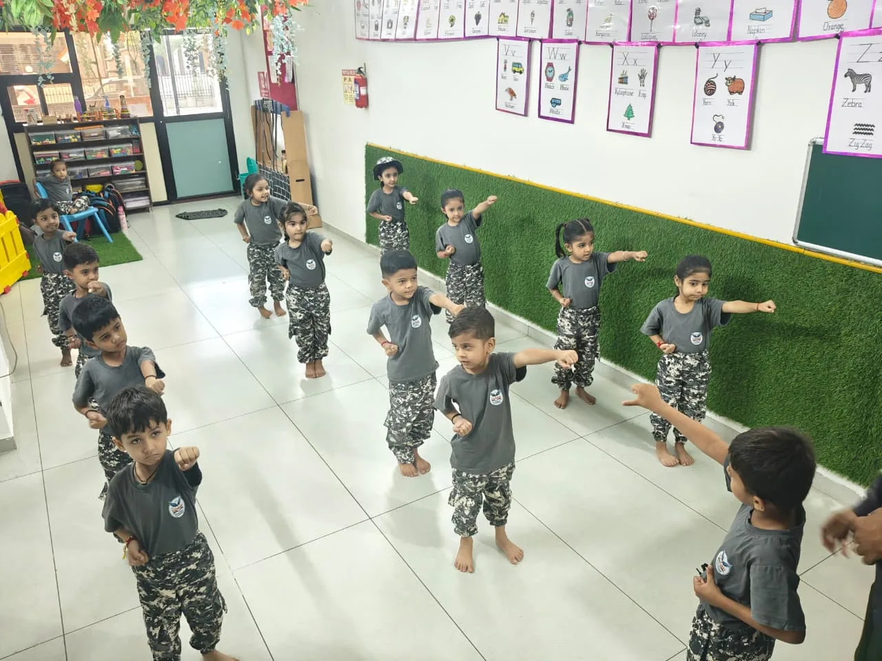 Children participating in a guided movement activity at The Udaan Preschool
